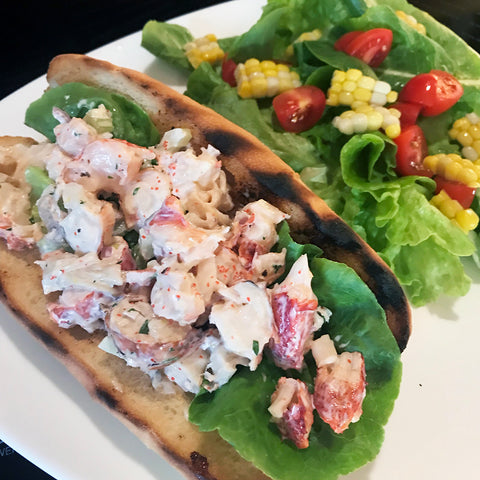 Lobster rolls on grilled buns with salad