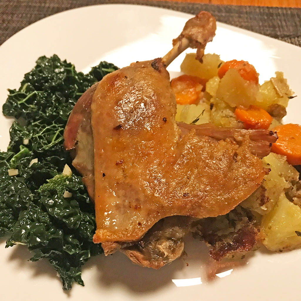 Duck Confit with Roasted Potatoes and Sautéed Kale